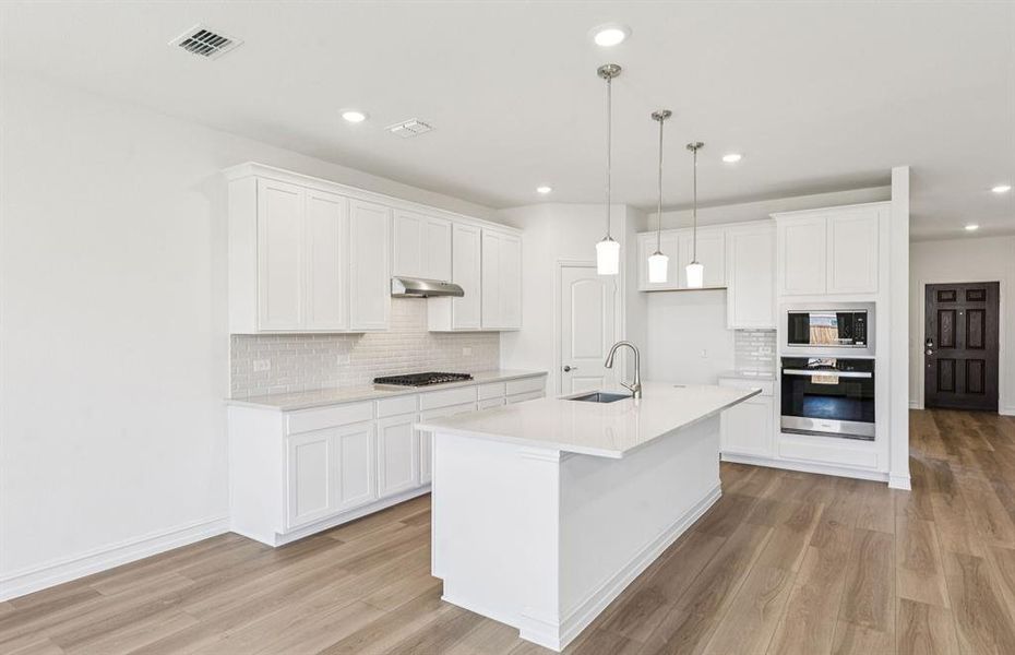 Spacious kitchen with eat-in bartop island Spacious kitchen with eat-in bartop island
