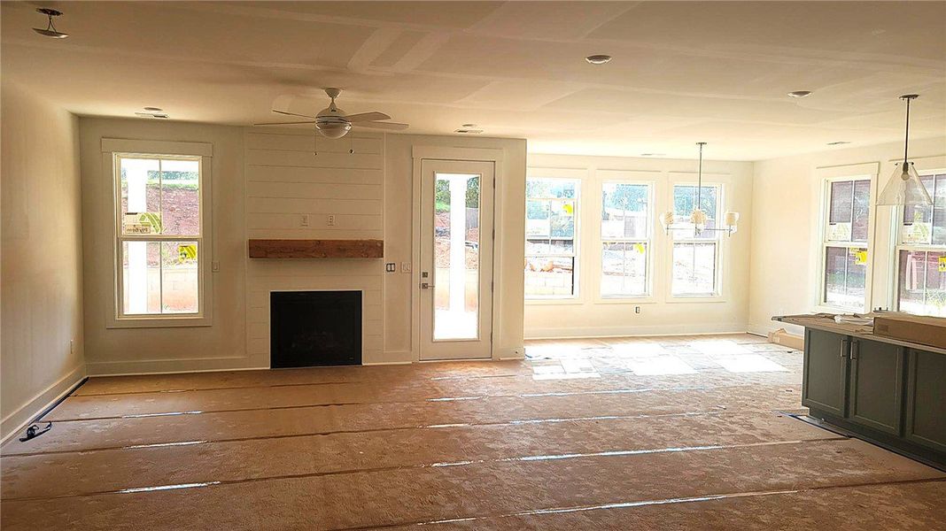 An open floorplan centers around a classic firepla An open floorplan centers around a classic firepla