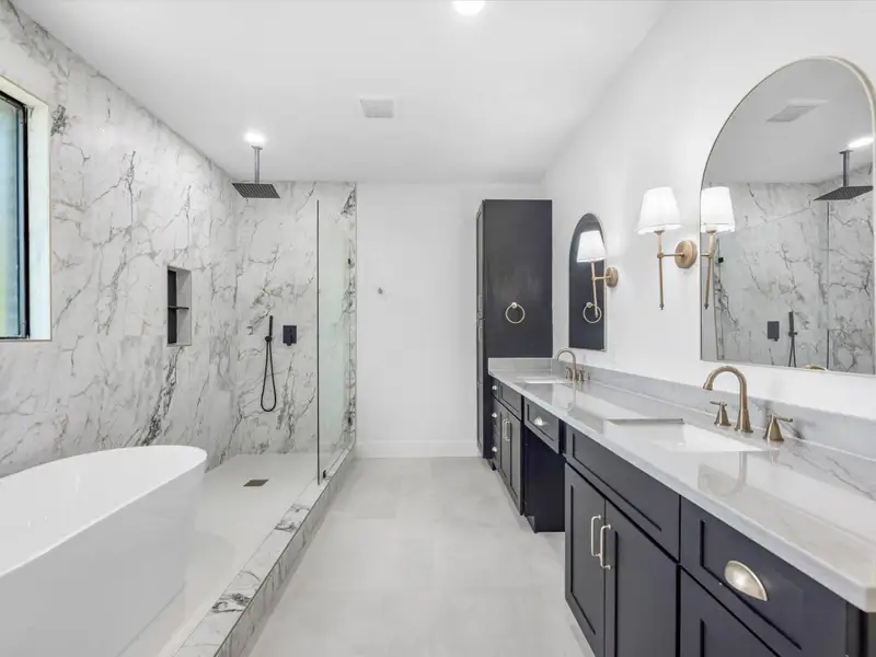 This bathroom has it all! Double sinks with plenty of countertop space. You have extra cabinets to maximize your storage.
