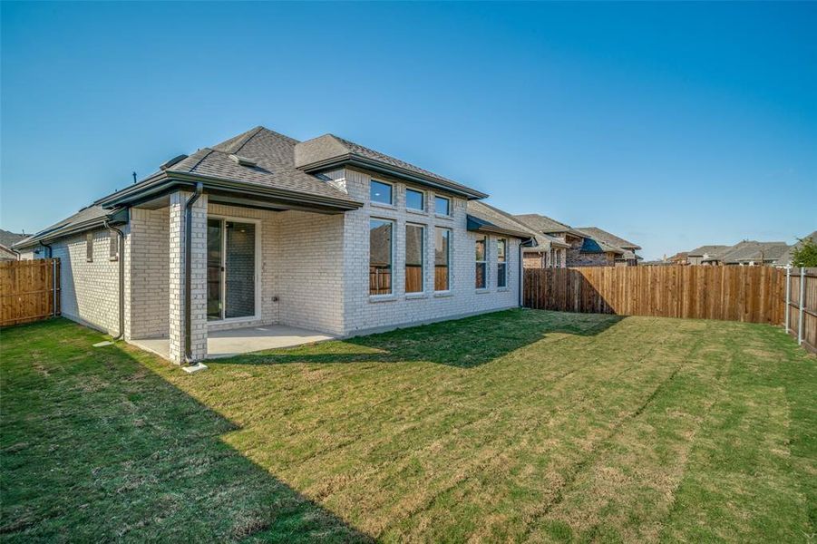 Exterior details and patio area of a home in West Crossing, Anna (Image 15).