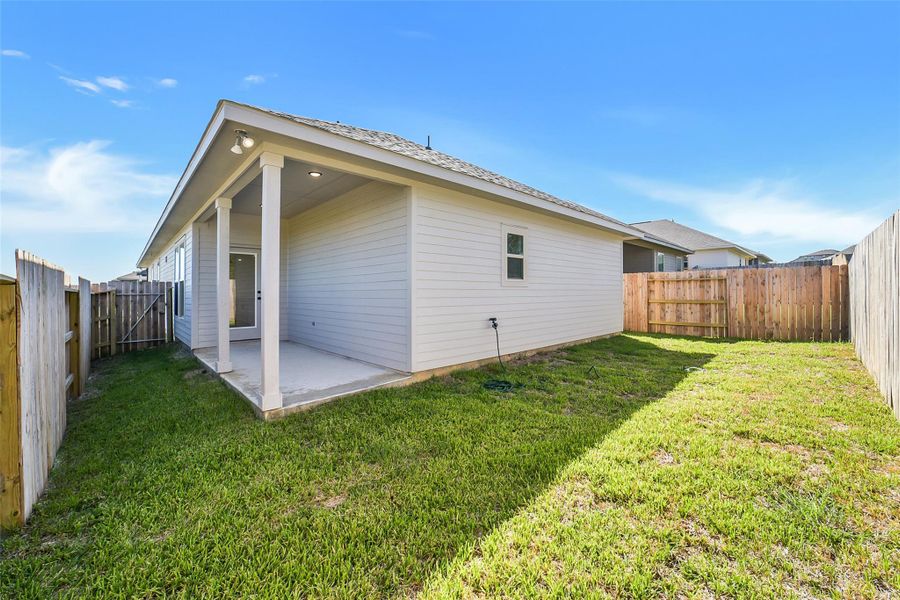 Exterior details and patio area of a home in Mostyn Springs, Magnolia (Image 17).