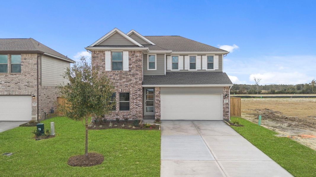 Front exterior of a new home in Windrose Green, Angleton, TX, highlighting curb appeal (Image 19).