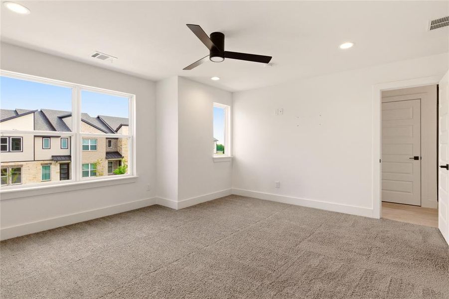 Unfurnished room with light carpet, recessed lighting, and a ceiling fan