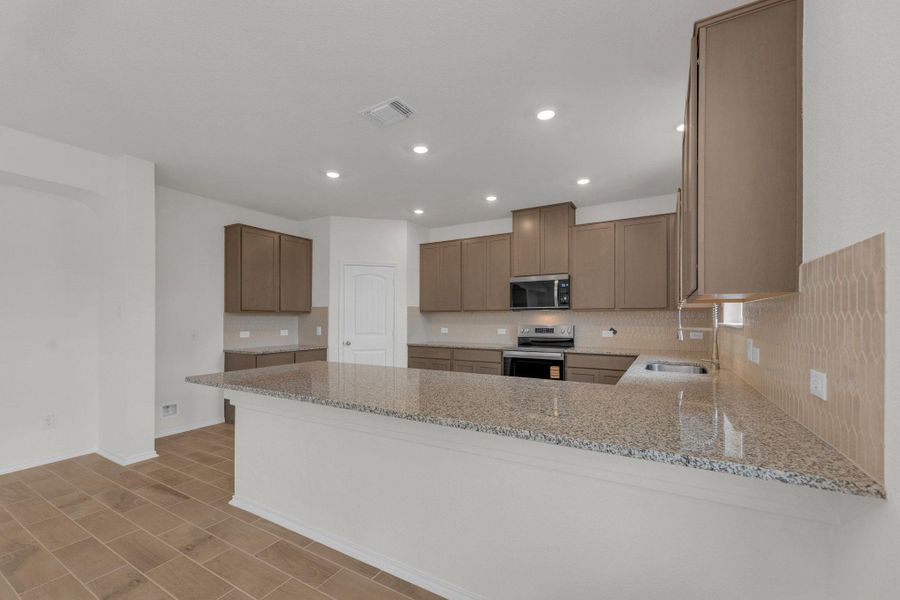 Furnished interior view inside a new home in Mustang Valley, Manor (Image 12).