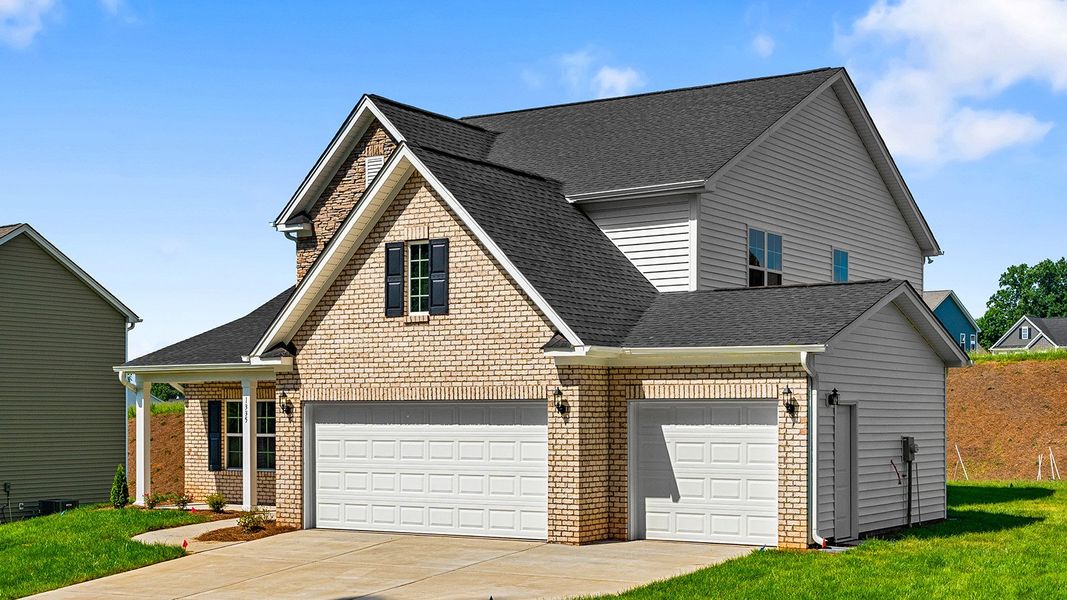 Front exterior of a new home in Brooke Hill, Lewisville, NC, highlighting curb appeal (Image 25). Front exterior of a new home in Brooke Hill, Lewisville, NC, highlighting curb appeal (Image 25).