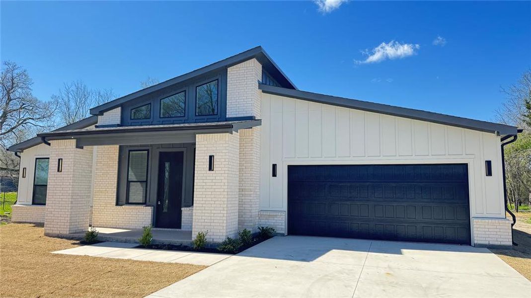 Front exterior of a new home in , Farmersville, TX, highlighting curb appeal (Image 22). Front exterior of a new home in , Farmersville, TX, highlighting curb appeal (Image 22).