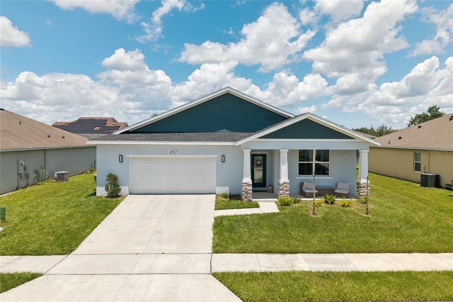 Front exterior of a new home in , Kissimmee, FL, highlighting curb appeal (Image 26). Front exterior of a new home in , Kissimmee, FL, highlighting curb appeal (Image 26).
