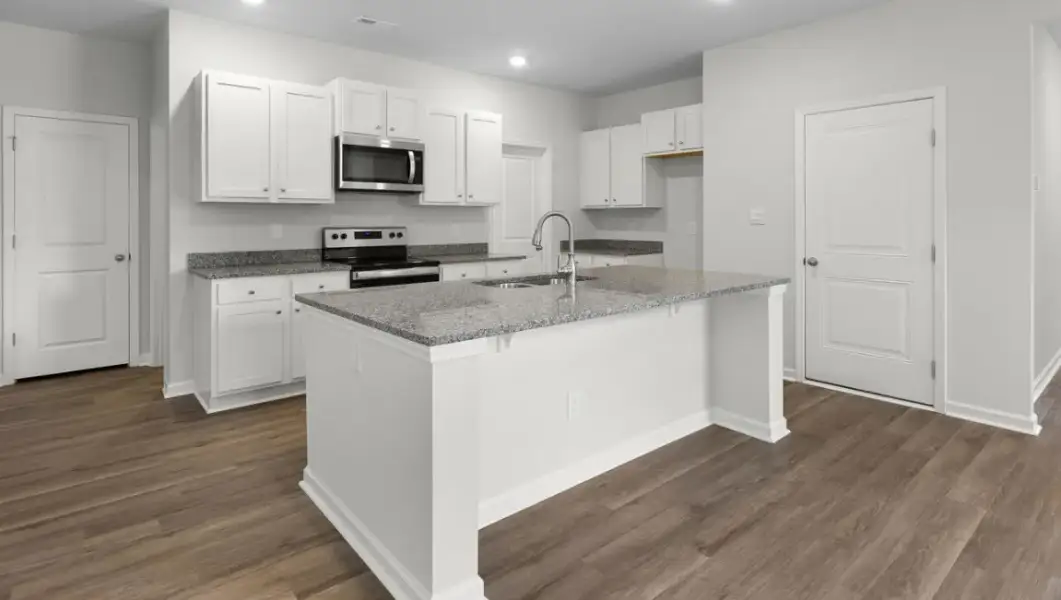 Furnished interior view inside a new home in The Highlands at Cedar Hill Landing, Navassa (Image 7).
