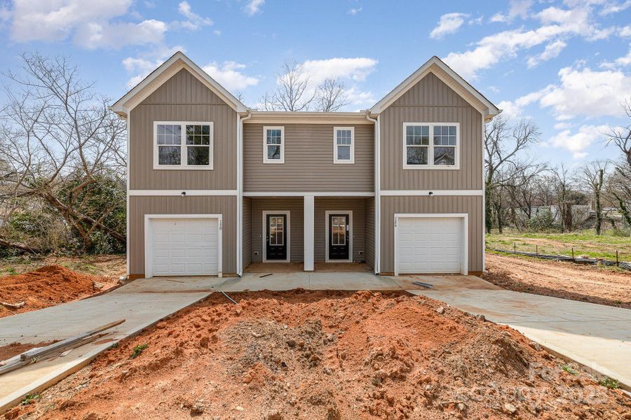Front exterior of a new home in , Statesville, NC, highlighting curb appeal (Image 1).
