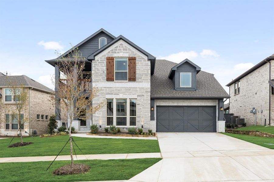 Front exterior of a new home in Union Park Classic 55, Little Elm, TX, highlighting curb appeal (Image 1).