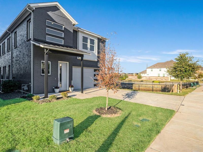 Exterior details and patio area of a home in Royal Court, Little Elm (Image 24).