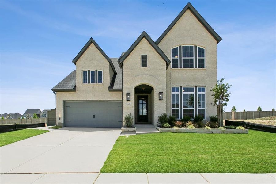 Front exterior of a new home in Treeline, Justin, TX, highlighting curb appeal (Image 2). Front exterior of a new home in Treeline, Justin, TX, highlighting curb appeal (Image 2).
