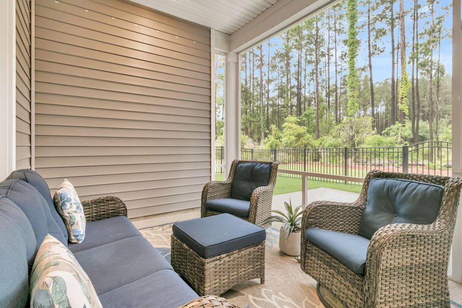 Exterior details and patio area of a home in K. Hovnanian's® Four Seasons at Lakes of Cane Bay, Summerville (Image 23).