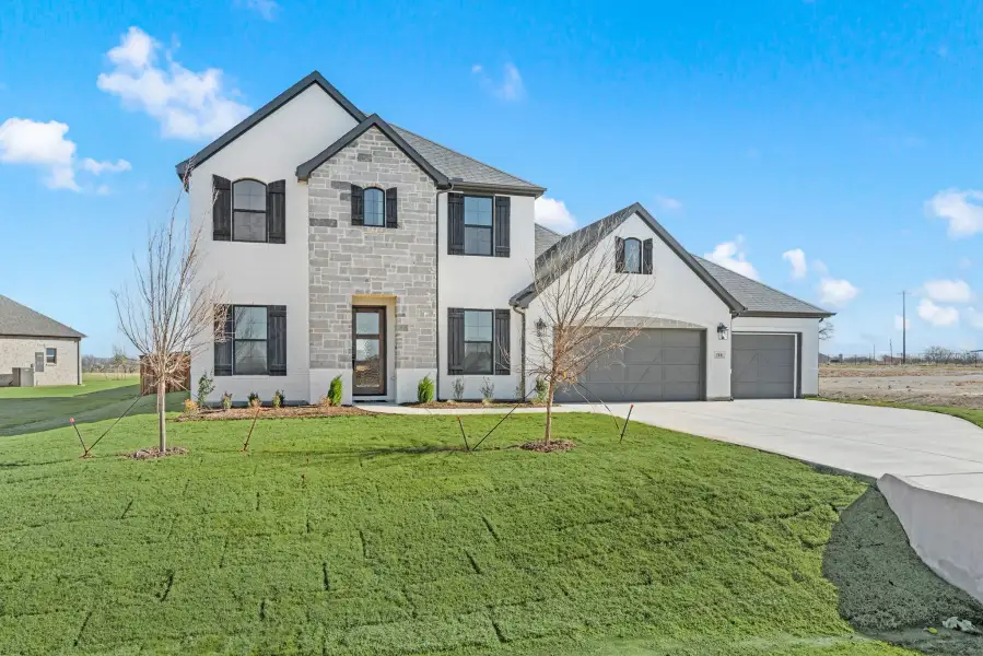 Front exterior of a new home in Settlers Glen, New Fairview, TX, highlighting curb appeal (Image 24).