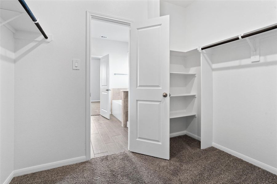 Look at this immaculate closet! With high shelving, multiple rows to hang clothing, you are sure to have enough room for all your belongings!