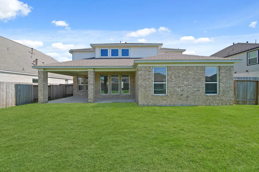 Front exterior of a new home in Beacon Hill, Waller, TX, highlighting curb appeal (Image 12). Front exterior of a new home in Beacon Hill, Waller, TX, highlighting curb appeal (Image 12).