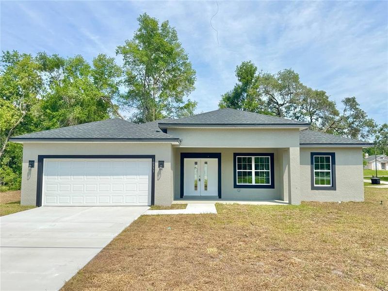 Front exterior of a new home in , Citrus Springs, FL, highlighting curb appeal (Image 2).