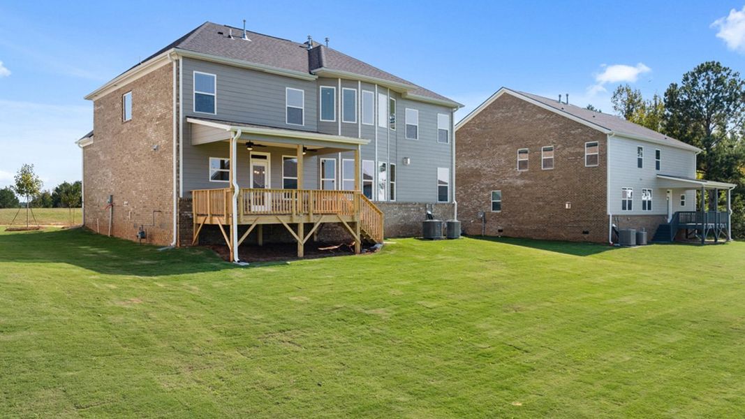 Front exterior of a new home in Heritage Pointe, Senoia, GA, highlighting curb appeal (Image 32). Front exterior of a new home in Heritage Pointe, Senoia, GA, highlighting curb appeal (Image 32).