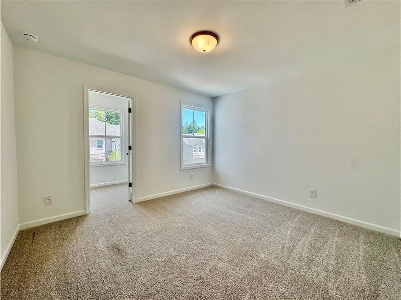 Spacious, unfurnished interior of a new home in Eastlyn Crossing, Flowery Branch (Image 21).