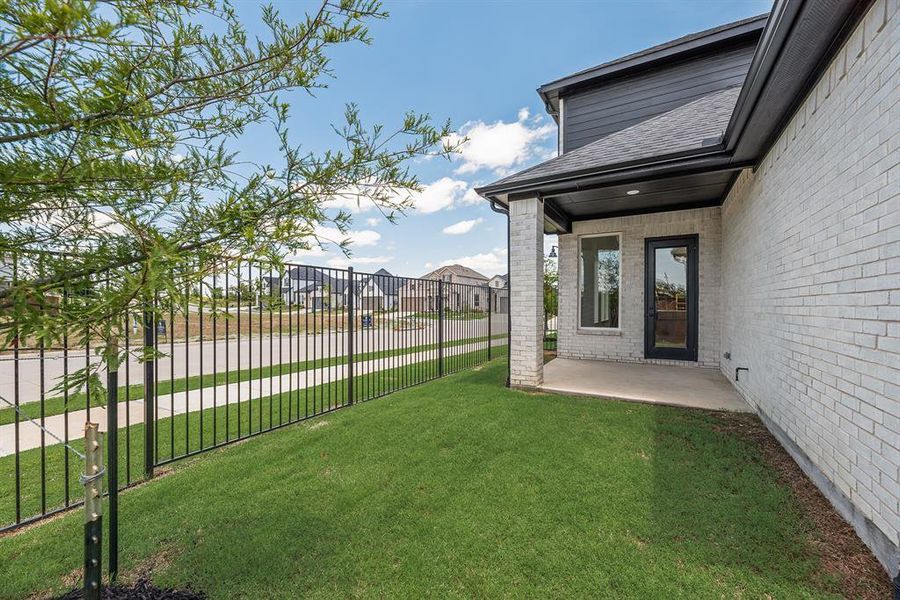 Exterior details and patio area of a home in Cottages of Celina, Celina (Image 26).