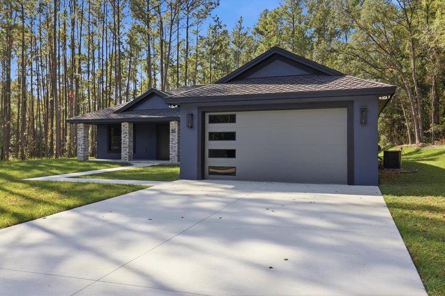 Front exterior of a new home in , Citrus Springs, FL, highlighting curb appeal (Image 32). Front exterior of a new home in , Citrus Springs, FL, highlighting curb appeal (Image 32).