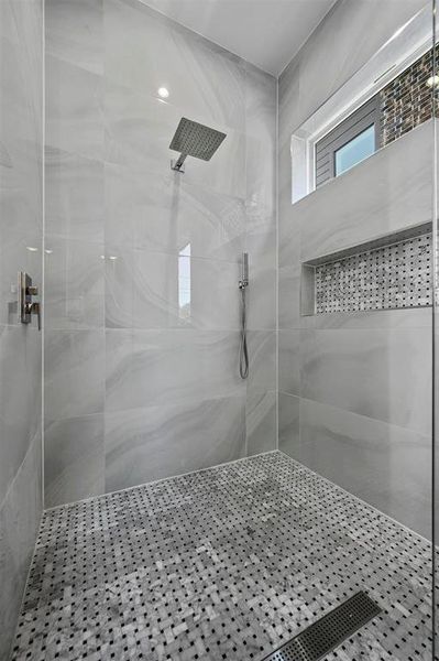 Bathroom featuring tiled shower