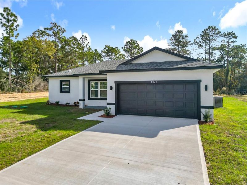 Front exterior of a new home in , Citrus Springs, FL, highlighting curb appeal (Image 22). Front exterior of a new home in , Citrus Springs, FL, highlighting curb appeal (Image 22).