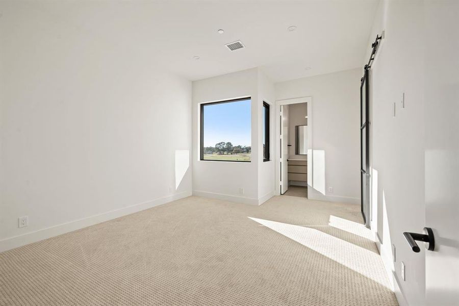 Light-filled secondary bedroom with backyard views. Light-filled secondary bedroom with backyard views.
