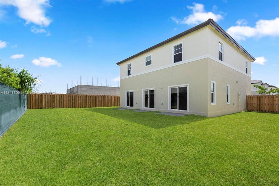 Front exterior of a new home in , Homestead, FL, highlighting curb appeal (Image 15).