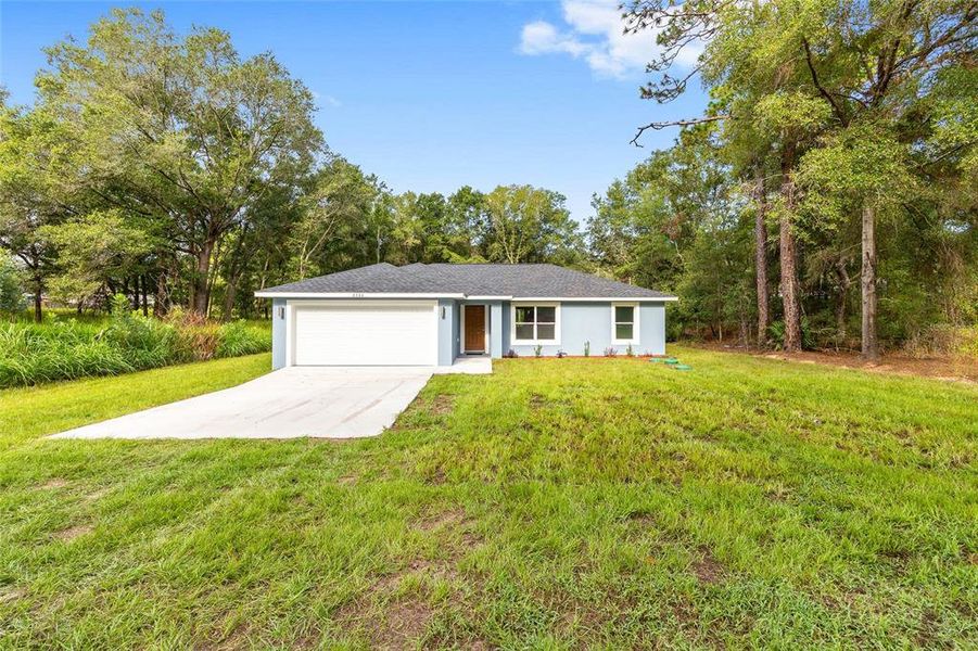 Front exterior of a new home in , Ocala, FL, highlighting curb appeal (Image 16).