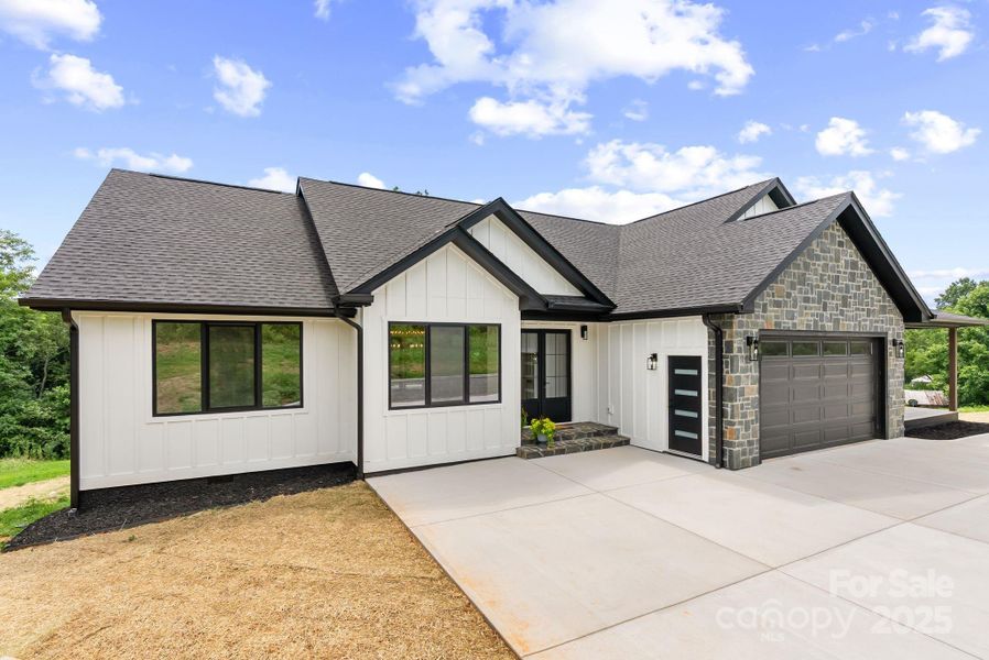 Front exterior of a new home in , Mills River, NC, highlighting curb appeal (Image 2).