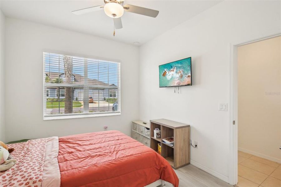 Guest bedroom with view of front of home. Guest bedroom with view of front of home.
