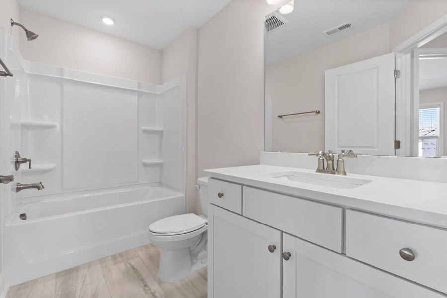 Furnished interior view inside a new home in Lakeside Townes at Riverlights, Wilmington (Image 8).