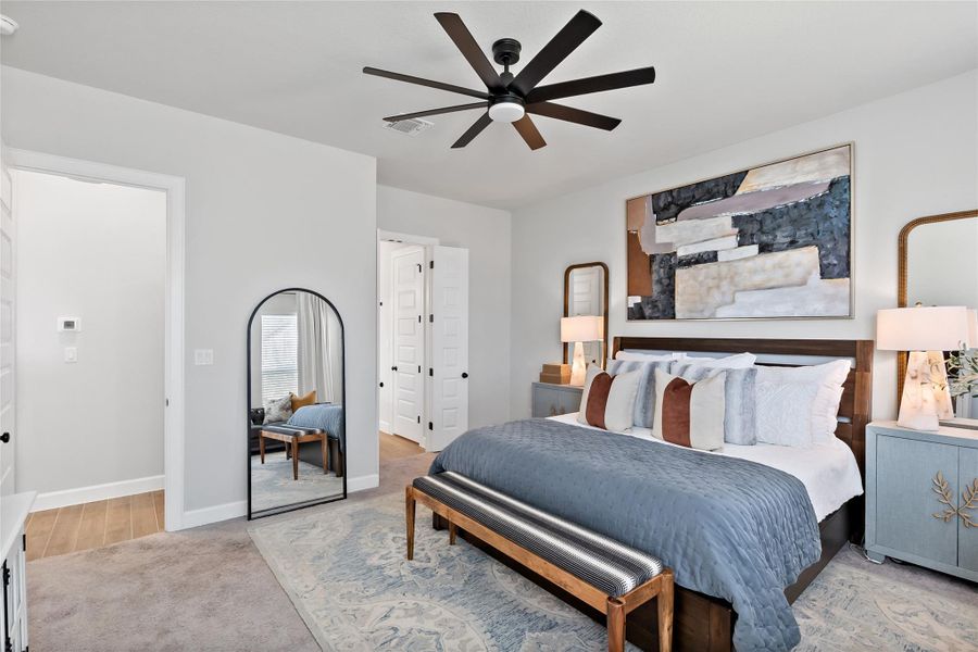 Bedroom featuring ceiling fan and light colored carpet