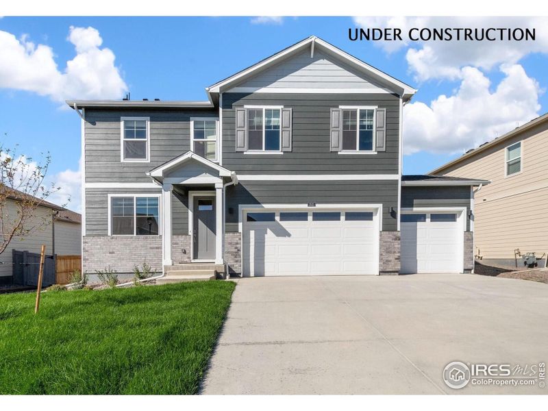 Front exterior of a new home in Vantage, Berthoud, CO, highlighting curb appeal (Image 1).