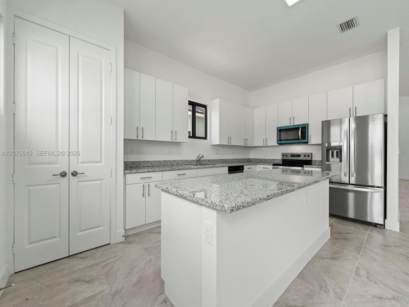 Furnished interior view inside a new home in , Homestead (Image 8). Furnished interior view inside a new home in , Homestead (Image 8).