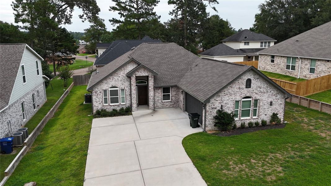 Front exterior of a new home in , Huntsville, TX, highlighting curb appeal (Image 13). Front exterior of a new home in , Huntsville, TX, highlighting curb appeal (Image 13).
