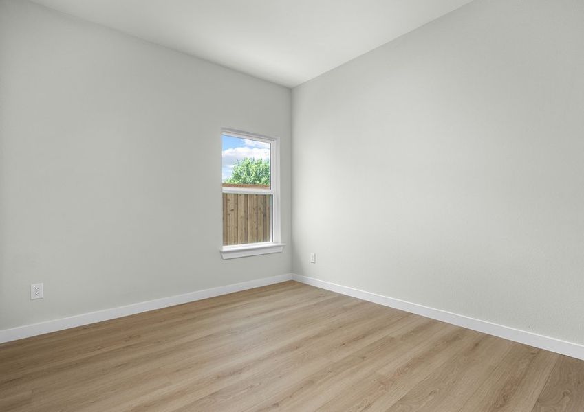Spacious secondary bedroom with beautiful luxury vinyl plank flooring.