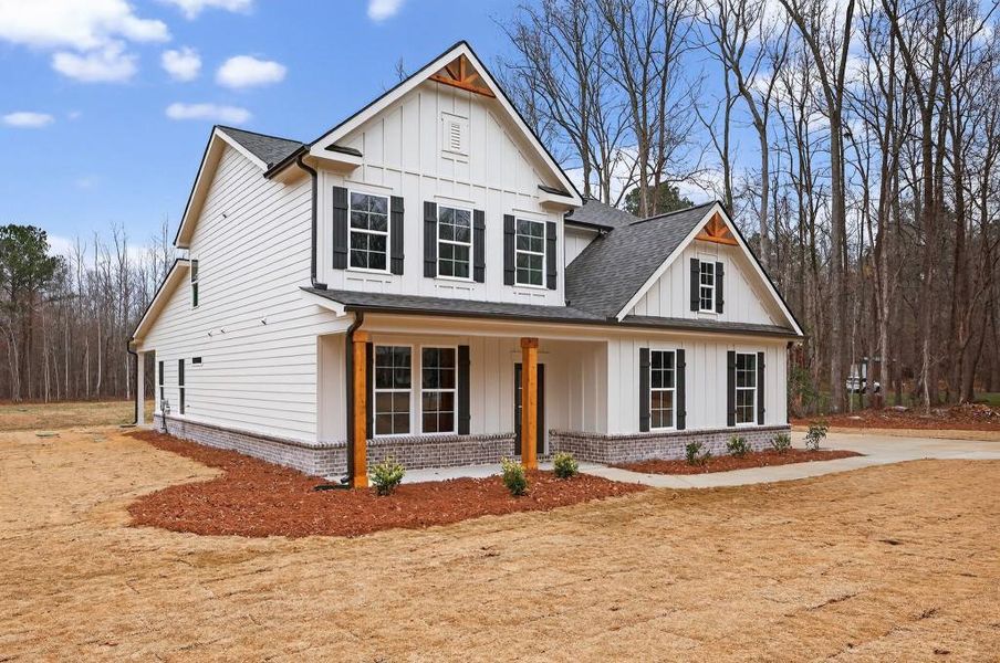 Front exterior of a new home in , Statham, GA, highlighting curb appeal (Image 26).