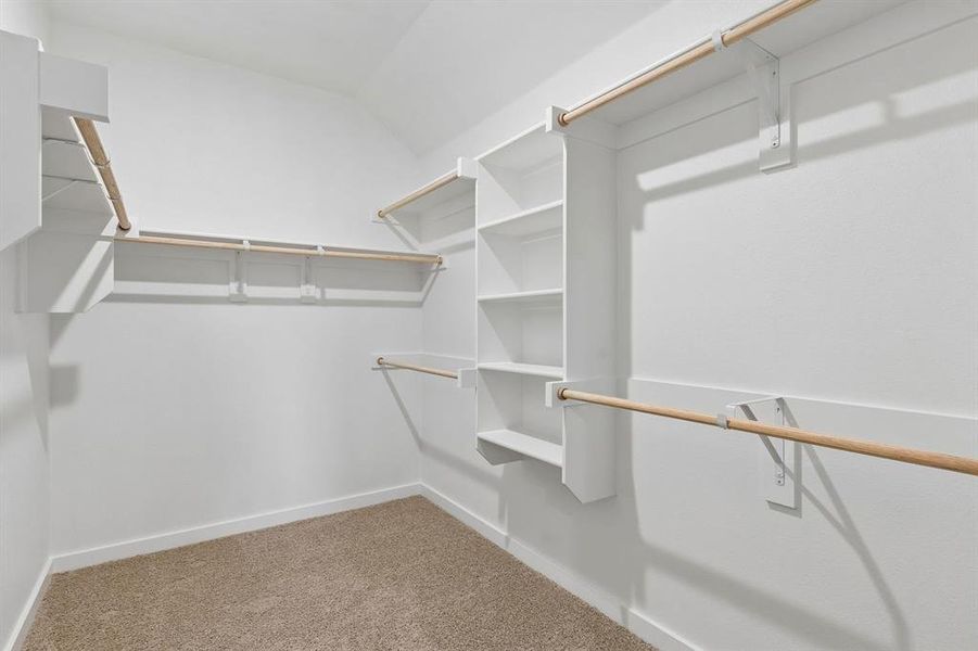 Primary Closet in the Oscar home plan by Trophy Signature Homes – REPRESENTATIVE PHOTO
