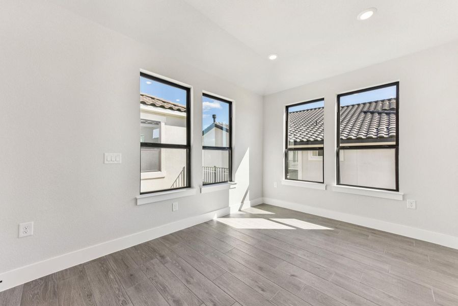 Unfurnished room featuring light wood finished floors and recessed lighting Unfurnished room featuring light wood finished floors and recessed lighting