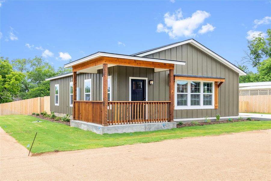 View of front of house with a porch and board and batten siding View of front of house with a porch and board and batten siding
