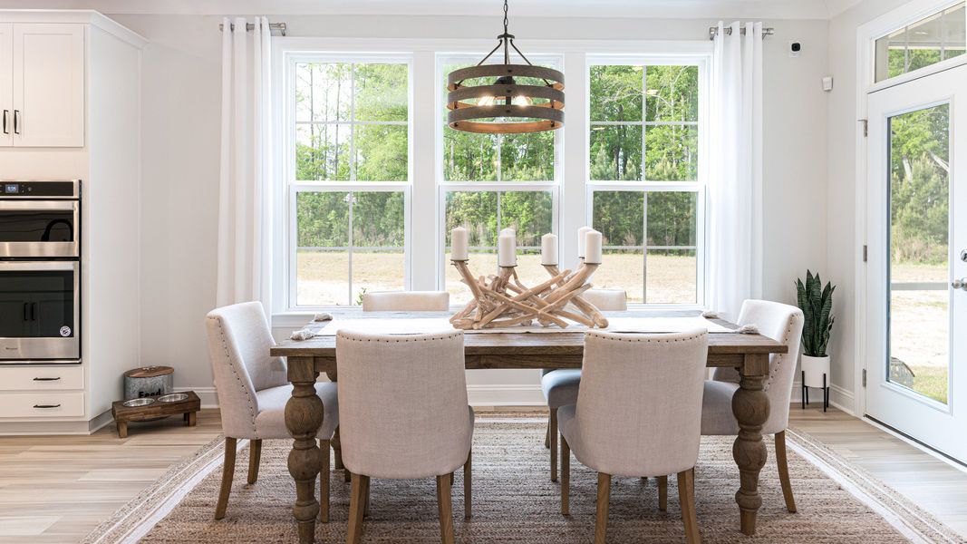 dining space with tons of light and door to rear screen porch dining space with tons of light and door to rear screen porch