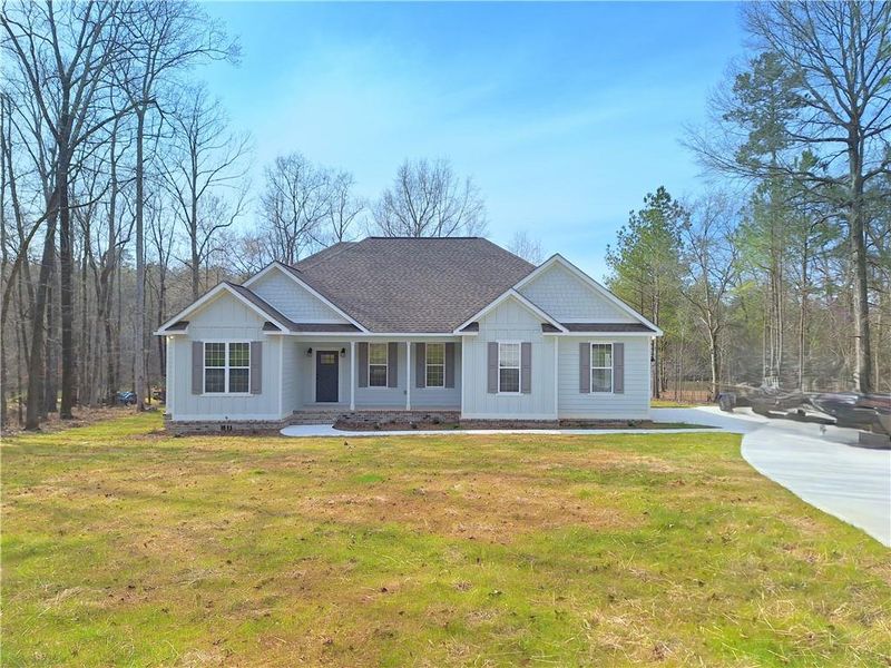 Front exterior of a new home in , Milledgeville, GA, highlighting curb appeal (Image 1).