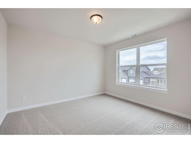 Spacious, unfurnished interior of a new home in RainDance National 60/70, Windsor (Image 25).