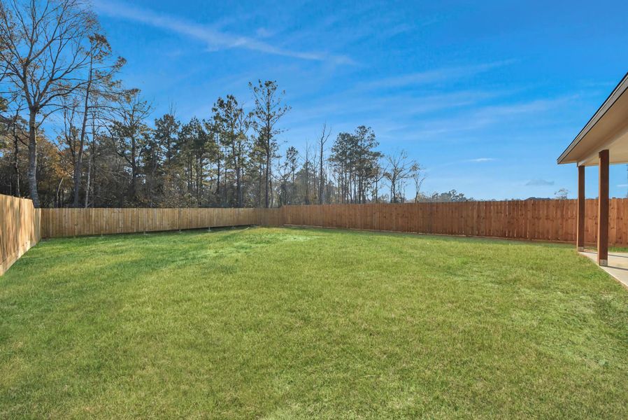 Exterior details and patio area of a home in , Conroe (Image 22).