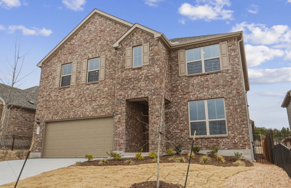 Front exterior of a new home in West Cypress Hills, Spicewood, TX, highlighting curb appeal (Image 25).