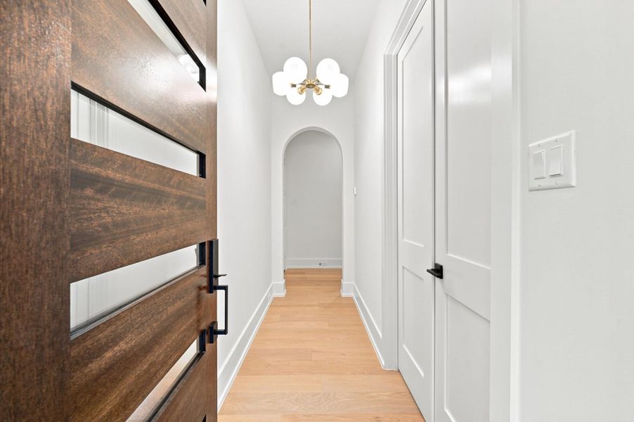 Step inside this thoughtfully designed home featuring elegant arched doorways throughout.