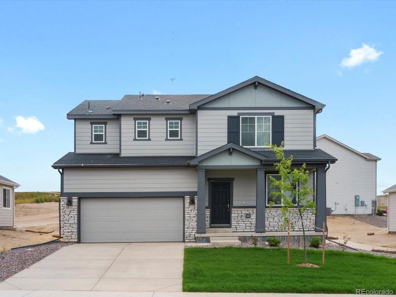 Front exterior of a new home in Poudre Heights: The Lakes Collection, Windsor, CO, highlighting curb appeal (Image 2).