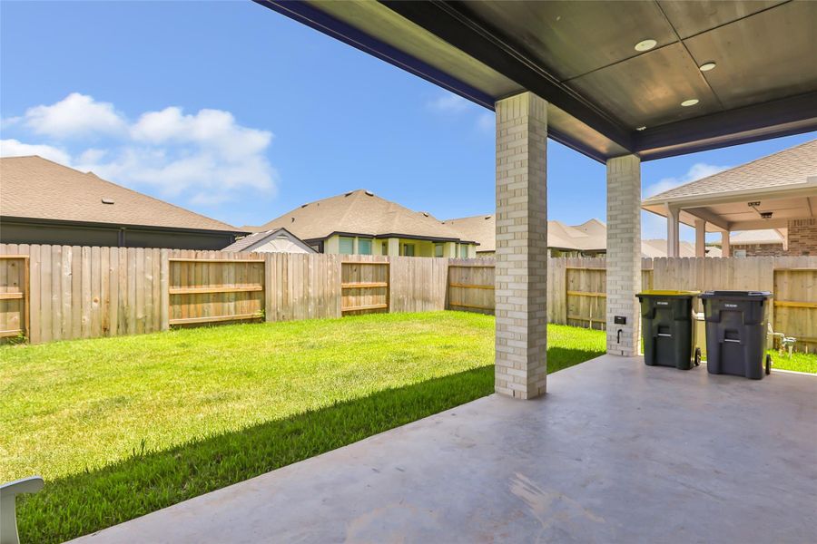 Exterior details and patio area of a home in Grand Central Park, Conroe (Image 28).